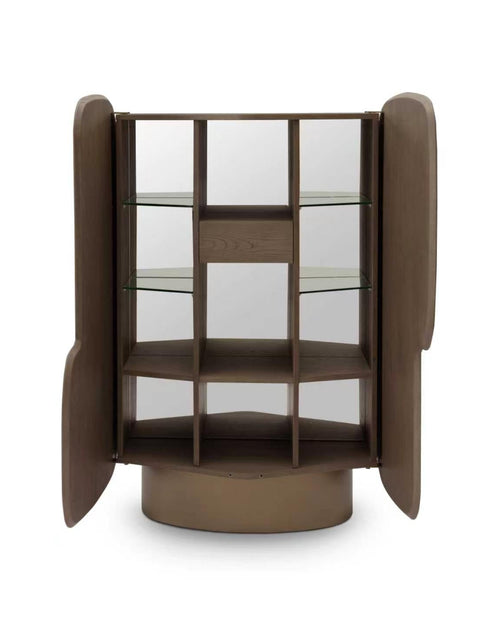 A modern corner display cabinet with a dark brown wood finish, featuring glass shelves and curved side panels, shown on a white background.