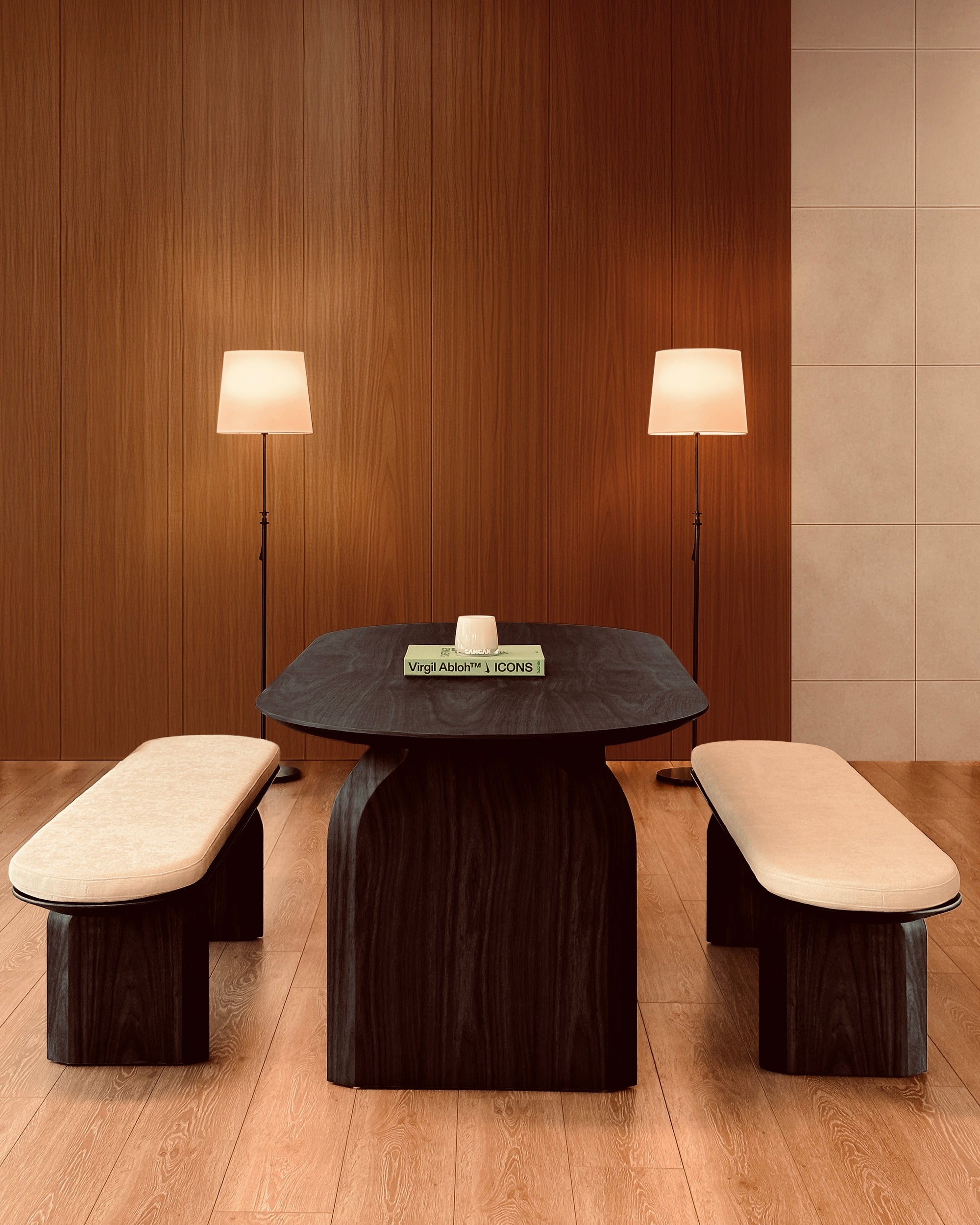 Modern dining set with dark wooden table and benches against a wooden wall.