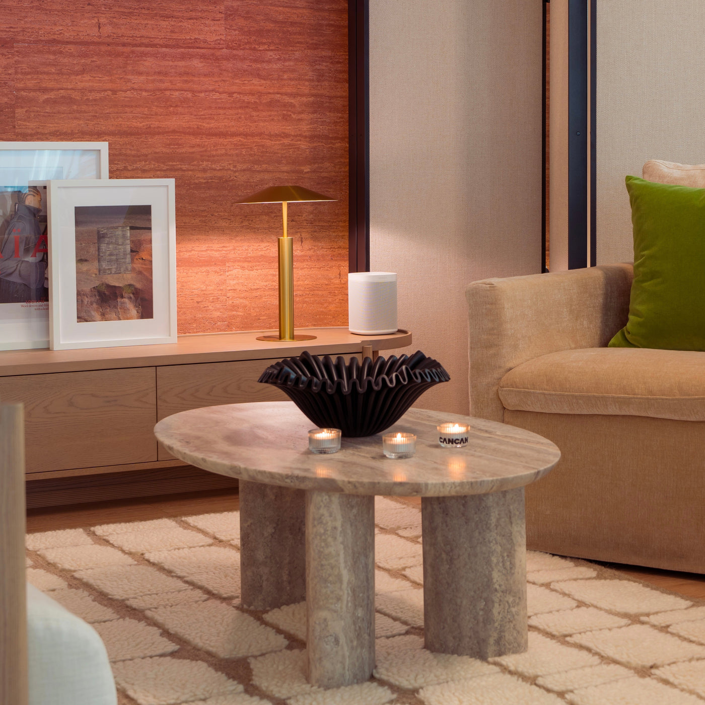 Modern living room with a coffee table, lamp, and couch.