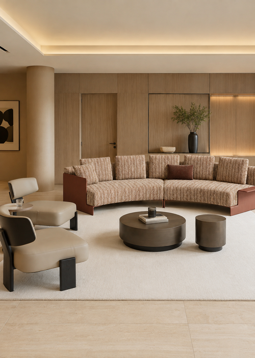 A modern curved sectional sofa upholstered in a beige and brown textured patterned fabric, set in a luxurious contemporary living room with matching beige armchairs, a round dark coffee table, and warm wood-paneled walls.