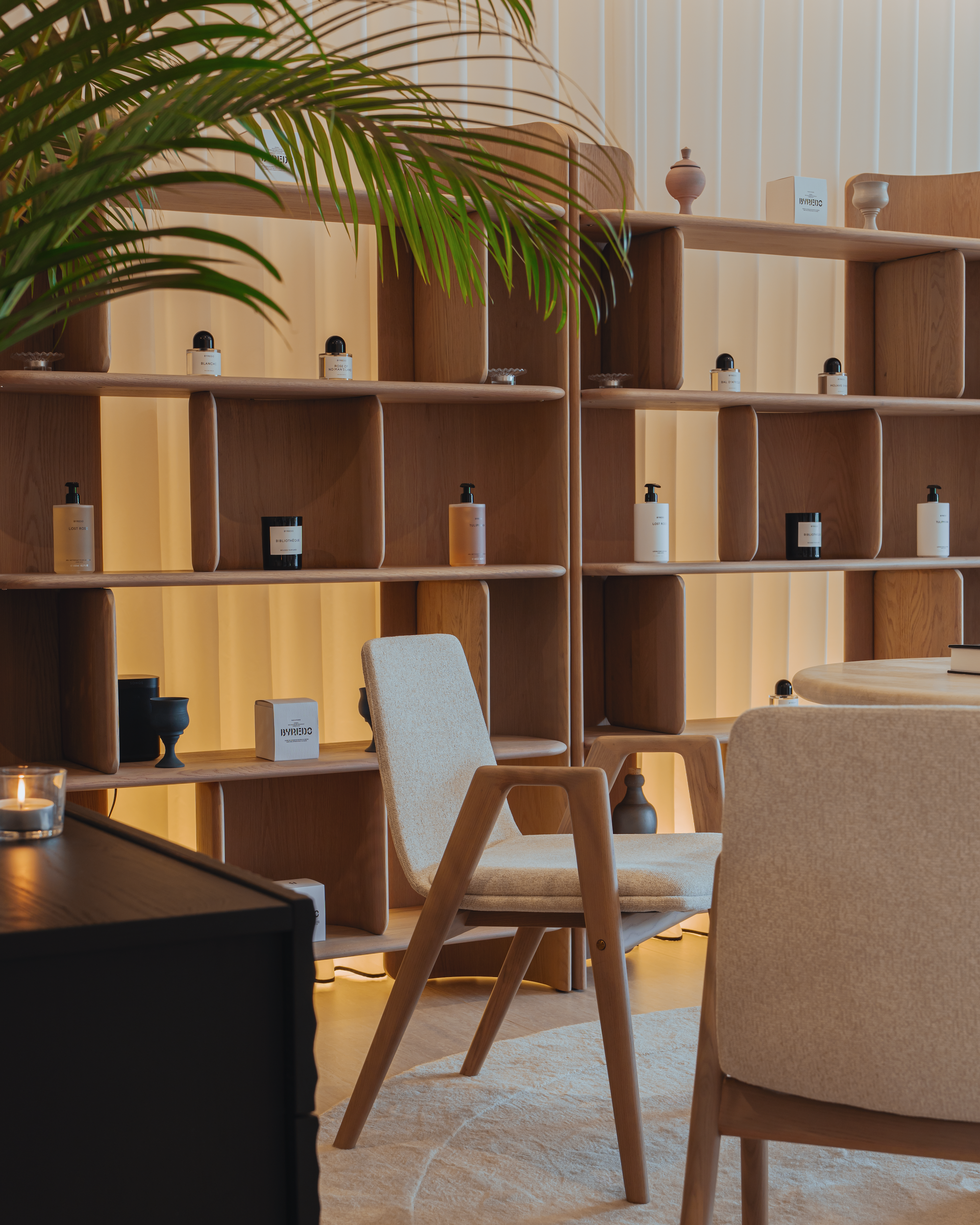 Modern interior with wooden shelves, chairs, and decorative items.