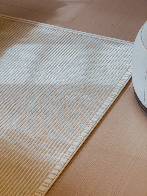 White textured mat on a wooden floor