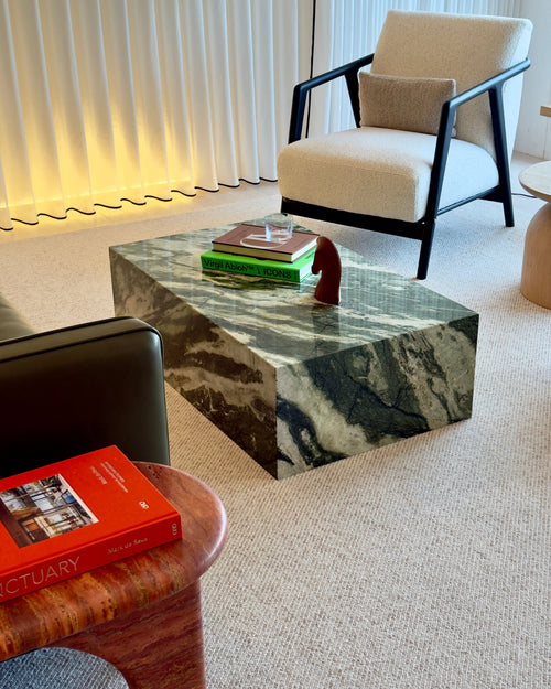 Modern living room with marble coffee table and armchair