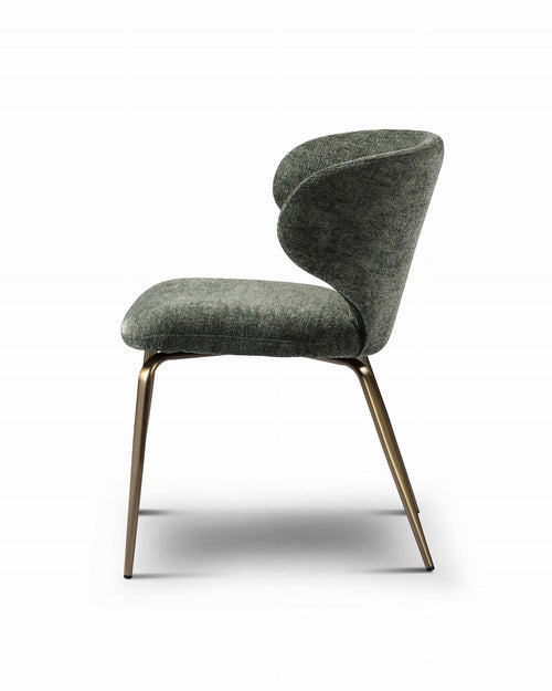 Modern green chair with bronze legs on a white background