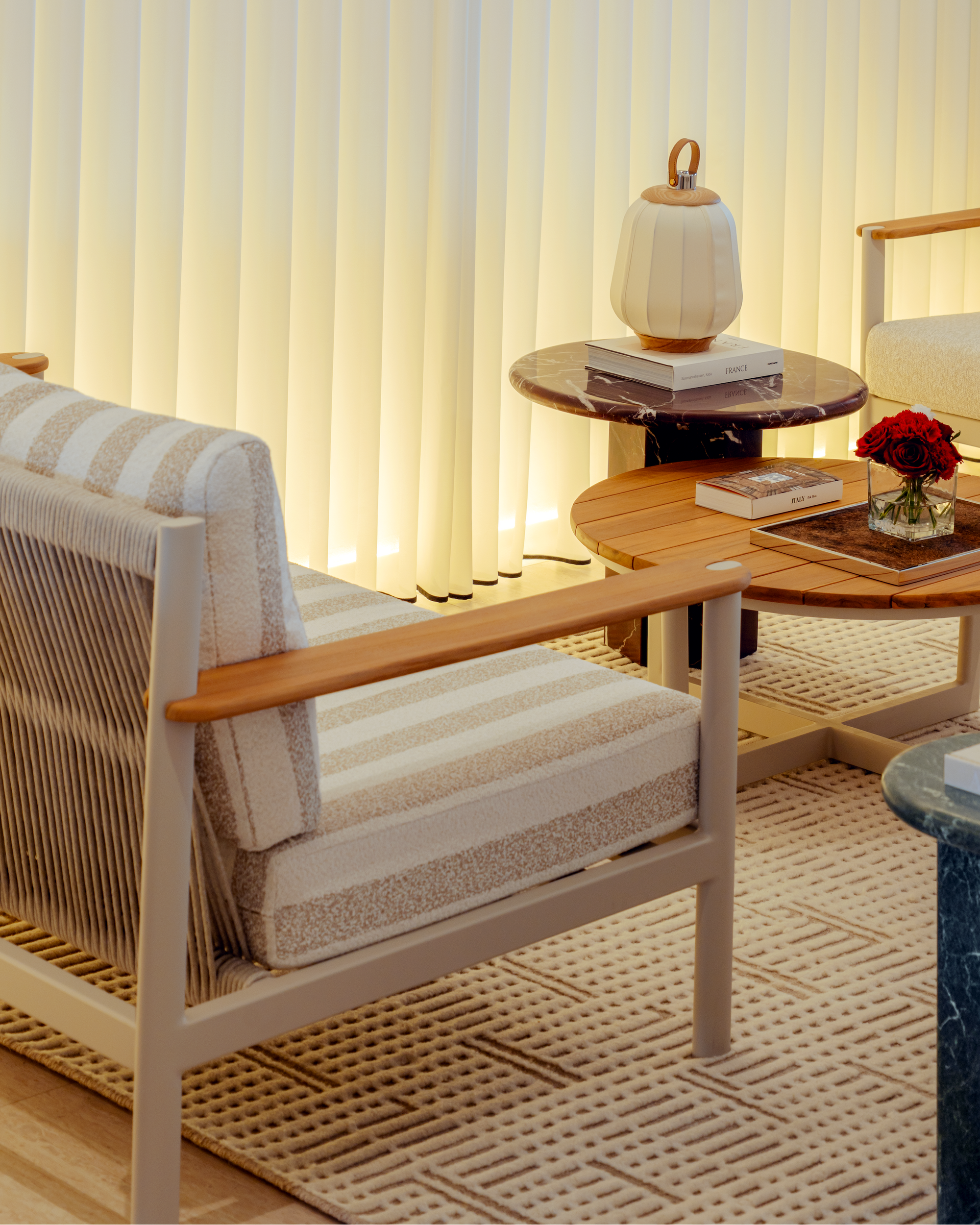 Modern living room with a chair, table, and decorative items.
