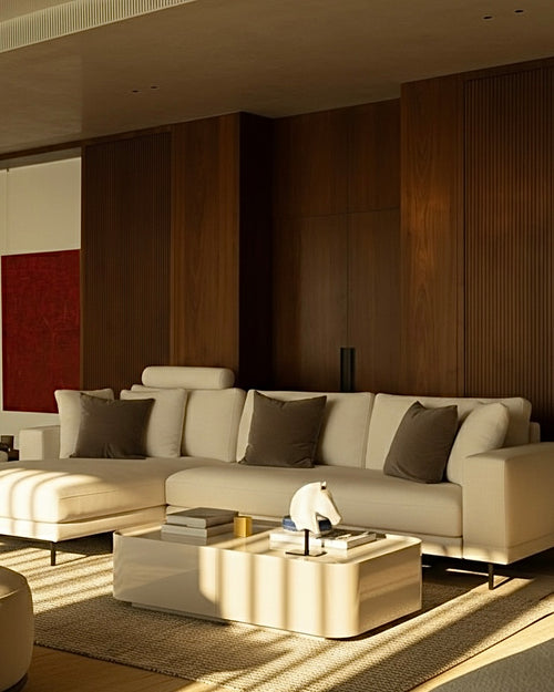 Modern living room with a beige sectional sofa and wooden coffee table.